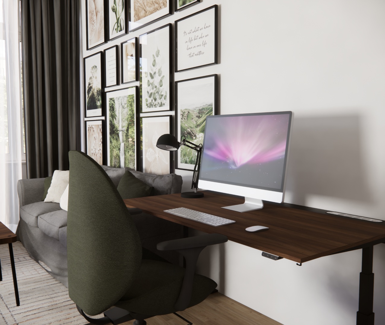 Biurko z dużym monitorem przy ścianie ozdobionej ramkami – kącik do pracy w salonie.